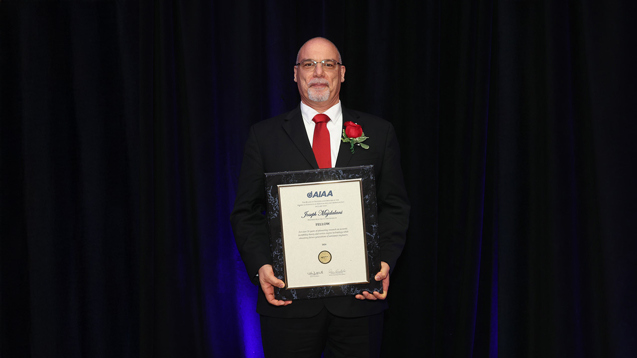 Joe Majdalani, the Hugh and Loeda Francis Chair of Excellence in the Department of Aerospace Engineering, receives a commemorative plaque as part of his induction as an AIAA Fellow on May 14 in Washington, D.C. 