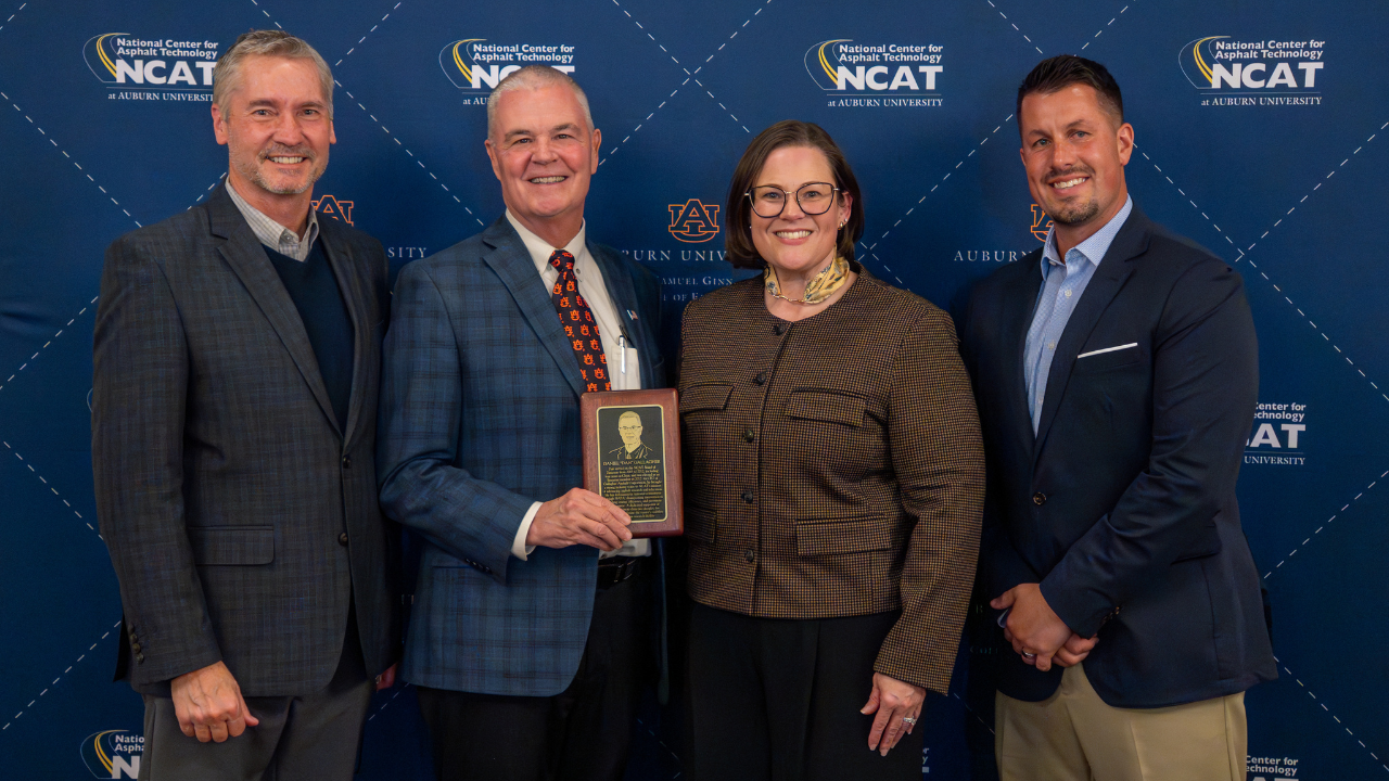 Dan Gallagher presented with commemorative plaque  for his induction onto the NCAT Wall of Honor. From left to right, Randy West, Dan Gallagher, Audrey Copeland, and Brian Enders