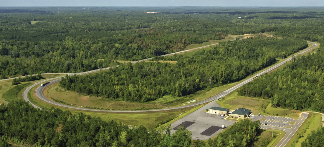 Aerial view of NCAT's 1.7-mile oval Test Track used for asphalt pavement research.